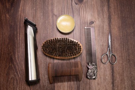 Foto de Different combs, brushes and other tools for grooming a beard. Close up view. - Imagen libre de derechos
