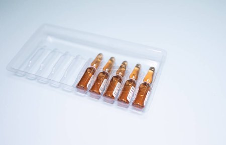 Photo for Medical ampoules in pack on light background - Royalty Free Image