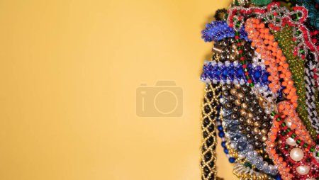Photo for Beads, Jewelry, beads necklaces on yellow background - Royalty Free Image