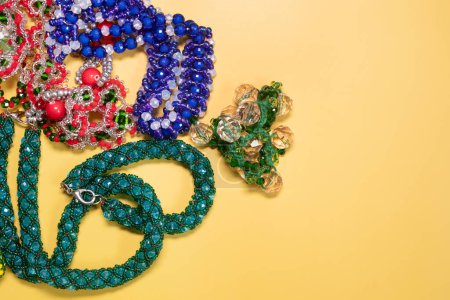 Foto de Beads, Jewelry, beads necklaces on yellow background - Imagen libre de derechos