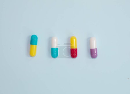 Téléchargez les photos : Pharmaceutical medicine pills, tablets and capsules on blue background. Medicine concept. - en image libre de droit