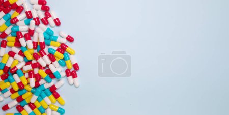 Photo for Pharmaceutical medicine pills, tablets and capsules on blue background. Medicine concept. - Royalty Free Image