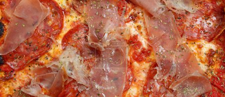 Photo for Pizza with Mozzarella cheese, ham, pepper, meat, tomato sauce, Spices and Fresh arugula. Italian pizza background. - Royalty Free Image