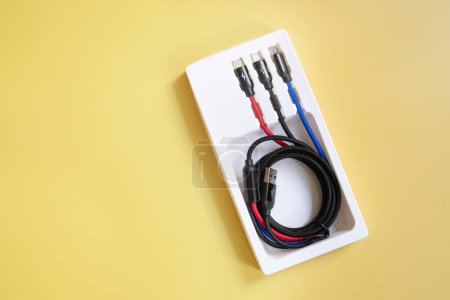 Photo for Power cables with plugs on yellow background - Royalty Free Image