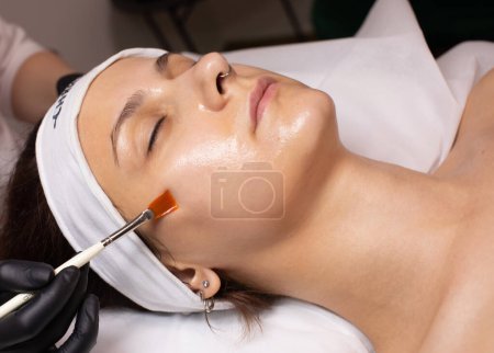 Photo for Cosmetology beauty procedure. Young woman skin care. Rejuvenation treatment. Facial chemical peel therapy. - Royalty Free Image