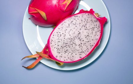 Photo for Close-up view of dragon fruit, exotic dragon fruit on blue background. Pitahaya. - Royalty Free Image