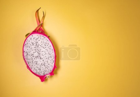 Photo for Close-up view of dragon fruit, exotic dragon fruit on yellow background. Pitahaya. - Royalty Free Image