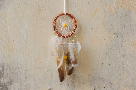 Photo for Handmade dreamcatcher close up tribal bohemian craft wall hanging outdoors - Royalty Free Image