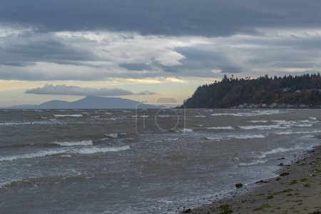 Photo for Ocean with big waves during stormy weather in BC, Canada. Seascape in overcast day. Nobody, selective focus, copyspace for text - Royalty Free Image