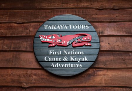 Photo for Canoe and Kayak Rental sign. Adventures sign welcomes tourists, offers guided Takaya tours, kayaks and canoes for rental for tourists. Information wooden sign-Vancouver BC Canada-November 21,2022 - Royalty Free Image