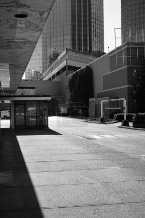 Photo for View of a modern city in black and white. Street view of city buildings in downtown Burnaby, shopping centre Metrotown area, Vancouver BC Canada-October 20, 2022- Travel photo, nobody - Royalty Free Image