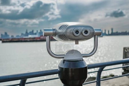 Photo for Tourist binocular by the beach on a sunny day. Street photo, nobody,copy space, travel photo. - Royalty Free Image