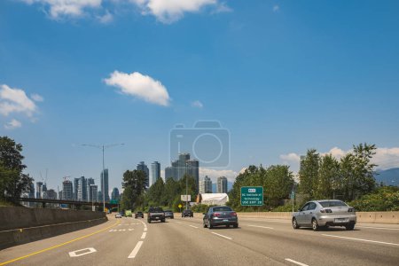 Photo for Vehicles travel along on Highway at the intersection of Trans-Canada Highway BC-1 near Burnaby BC Canada. Traffic on highways near Vancouver on a summer sunny day. Travel photo, editorial-June 1,2023 - Royalty Free Image