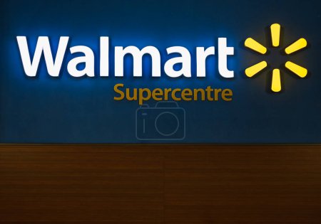 Photo for Walmart superstore exterior facade brand and logo signage at night. Walmart is an American multinational retail corporation that operates a chain of hypermarkets-July 27,2023-Vancouver Canada - Royalty Free Image