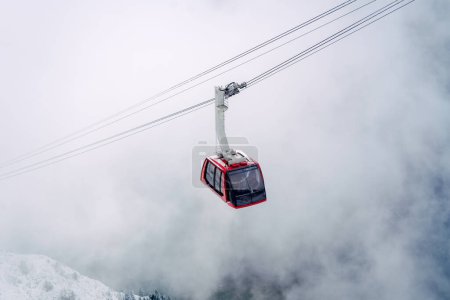 Photo for Red cable car foggy surroundings, Lucerne, Switzerland - Royalty Free Image