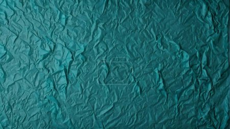 turquoise rough background, tissue paper with space for an inscription