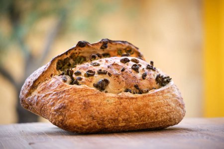 Photo for Delicious freshly baked rustic bread with olives . High quality photo - Royalty Free Image