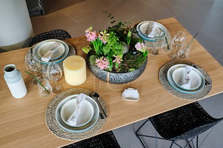 Photo for High angle of table serving with decorating beautiful and modern services and flowerpot at home - Royalty Free Image