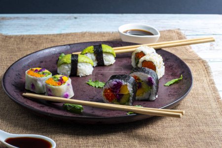 Photo for Nice plate of vegetable sushi, rich and tasty sushi assortment perfect for eating - Royalty Free Image