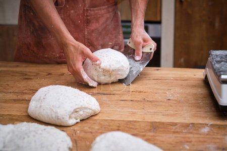 Photo for Photo detail of a baker Photo detail of a baker's hands working the bread dough 's hands working the bread dough . High quality photo - Royalty Free Image