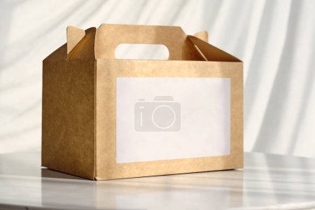 Photo for Carton package for packing goods and empty space for inscription placed on table - Royalty Free Image