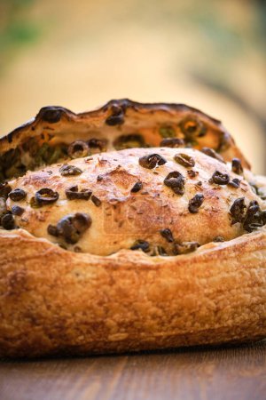 Photo for Delicious freshly baked rustic bread with olives . High quality photo - Royalty Free Image