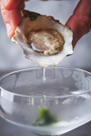 Photo for Refreshing martini cocktail with fresh oysters - Royalty Free Image