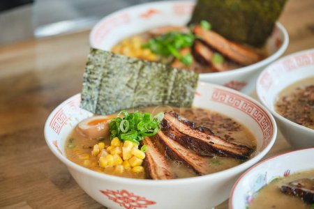 Photo for Stock photo of yummy ramen soups with boiled egg and meat in japanese restaurant ready to be served. - Royalty Free Image
