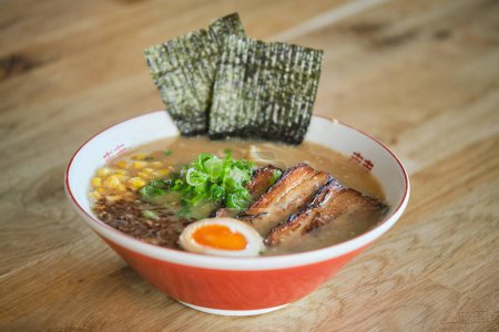Photo for Stock photo of yummy ramen soup with boiled egg and meat in japanese restaurant ready to be served. - Royalty Free Image