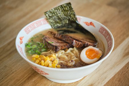 Photo for Stock photo of yummy ramen soup with boiled egg and meat in japanese restaurant. - Royalty Free Image