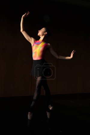 Photo for Warm-up and rehearsal of a professional ballet dancer - Royalty Free Image