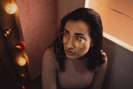 Photo for Young woman with yellow glasses posing - Royalty Free Image