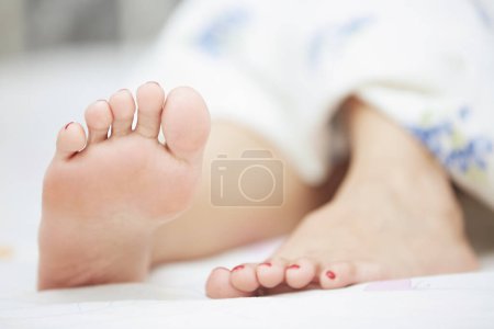 Photo for Feet of sleeping woman. Horizontal photo - Royalty Free Image