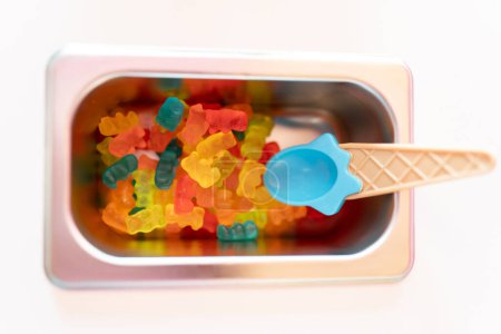 Photo for Close up photo of a metal tray filled with teddy bear gummy toppings on an ice cream parlor counter. Concept of small business - Royalty Free Image