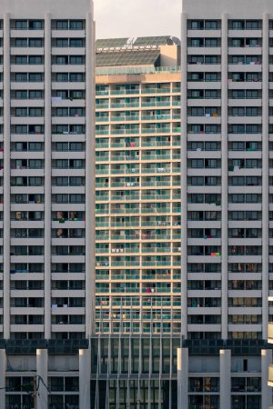 Photo for Tall high rise buildings with balconies and windows located on street of modern city in daytime - Royalty Free Image