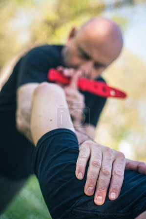 Photo for Knife attack self-defense. Techniques of disarming knife attacker. Weapon disarm training - Royalty Free Image