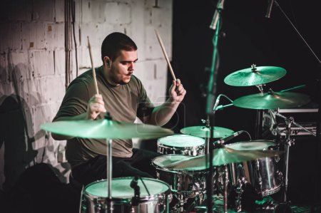 Photo for Drum music band drummer artist have solo live performance on a stage. Repetition and practice - Royalty Free Image