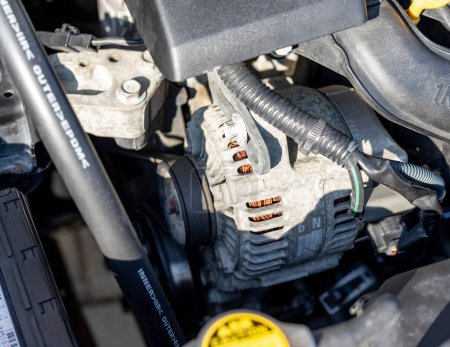 Téléchargez les photos : Car alternator or electric generator in the engine of a vehicle - en image libre de droit