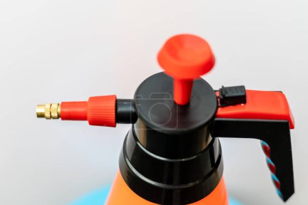 Closeup of a small sprayer on white isolated background