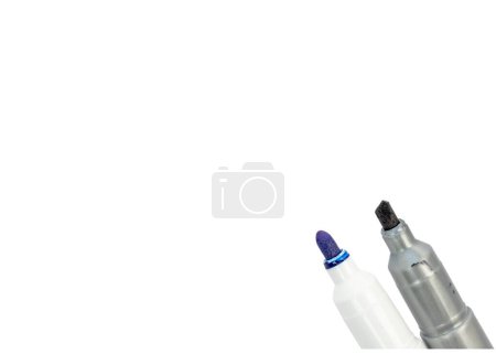 Photo for Black and blue markers on bottom right corner of a white background - Royalty Free Image