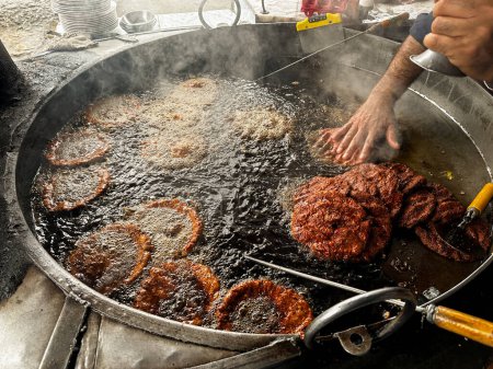 Photo for Chapli kabab is a Pashtun-style minced kebab usually made with beef and is a popular street food throughout South Asia - Royalty Free Image