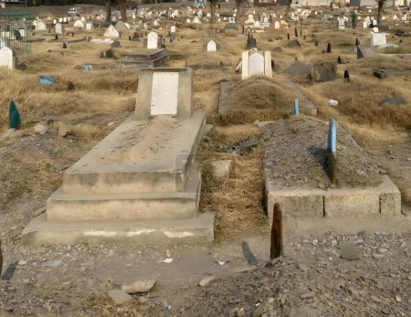 Photo for Gravestones and graves at Muslim cemetery in Pakistan - Royalty Free Image