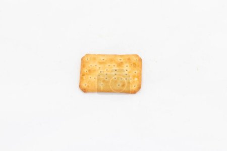 A single piece of salty cracker in rectangular shape on white isolated background with copy space.