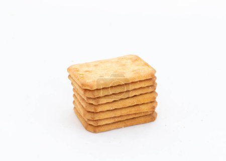 Closeup of a stack of salty crackers biscuits isolated on white background