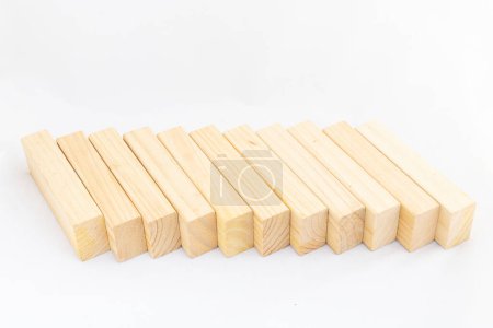 Photo for A long line of wooden uneven rectangular cubes isolated on white background. Blank cubes with space for text, - Royalty Free Image