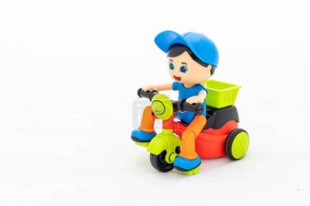 Colorful toy cycle with kid on white isolated background