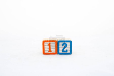 Wooden block one and two number on white background with copy space