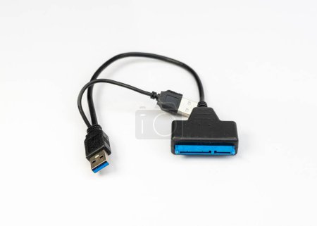 Foto de Adaptador de clabe USB SATA para transferencia de datos del disco duro - Imagen libre de derechos