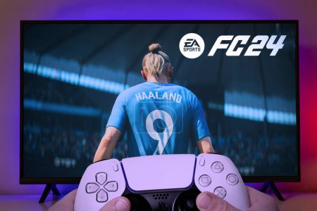 Photo for Boy playing EA FC 24 with Playstation 5 controller on TV screen, 24 Jul, 2023, Sao Paulo, Brazil - Royalty Free Image