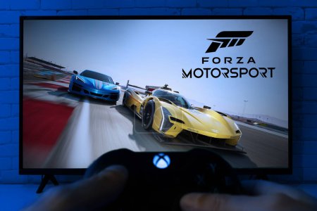 Photo for Man playing Forza Motorsport on Xbox, 7 Nov, 2023, Sao Palo, Brazil. - Royalty Free Image